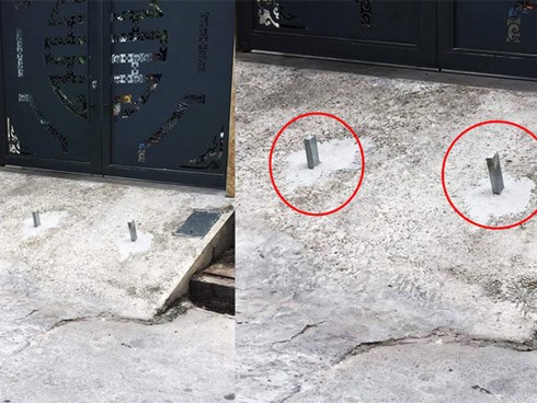 Chôn 2 cọc sắt trước cổng để bẫy xe lùi ké, chủ nhà khiến tất cả kinh hãi