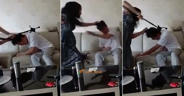 Cảnh vợ túm tóc, dùng gậy đánh chồng tới tấp trong khi nạn nhân kêu rên đau đớn gây xôn xao cộng đồng mạng-1