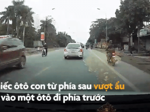 Xe tải vượt ẩu bị ép đi lùi về đúng làn-1