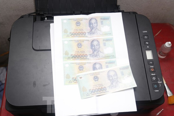 Rao bán tiền giả tràn lan-3