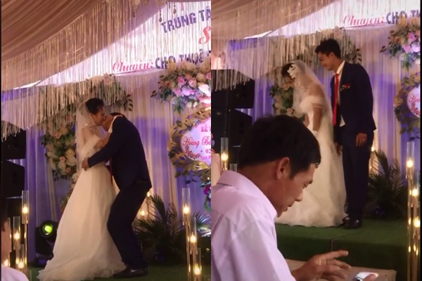 Chú rể có hành động gây sốc khi hôn cô dâu ngay trên sân khấu hôn lễ khiến nhiều người bàng hoàng chẳng hiểu lí do là sao-1