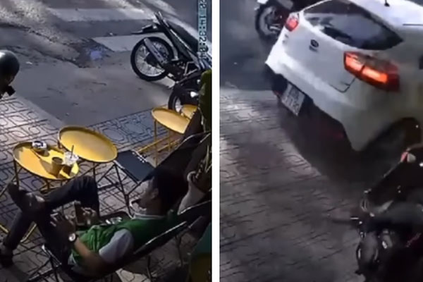 Bị ép sát vào dải phân cách, thanh niên phóng xe máy lên dằn mặt ô tô, camera bóc lỗi sai ngay từ đầu-1