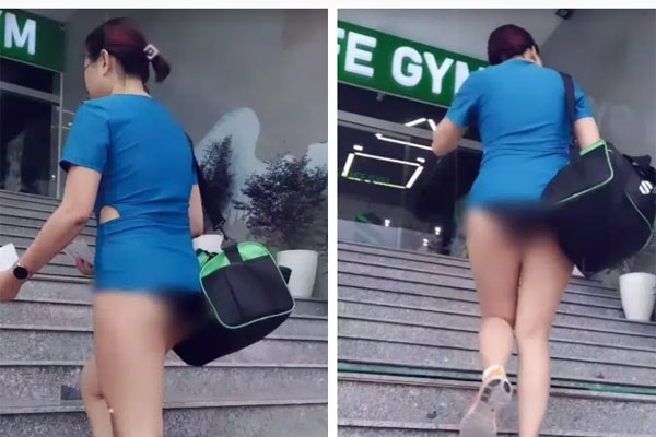 Người phụ nữ thả rông đi khắp Sài Gòn cùng chồng con lại tiếp tục mặc áo xuyên thấu khoe ngực trần tạo kiểu khó hiểu trước Đền Ngọc Sơn-7