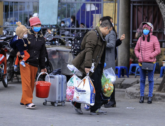 Sau Tết, người dân trở lại Hà Nội và TP HCM cần khai báo y tế như thế nào và làm những gì?-1