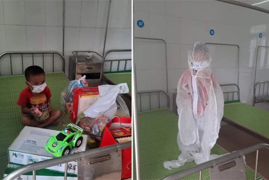 Xót xa hình ảnh cháu bé 4 tuổi mắc Covid-19 tay ôm khư khư hộp sữa, mặc đồ bảo hộ kín mít trong khu cách ly