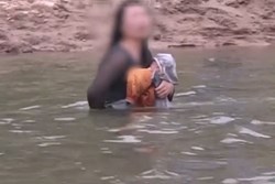Mẹ ôm con nhảy sông tự tử được đội cứu hộ giúp đỡ, hành động tiếp theo của cô ta làm dấy lên căm phẫn: 'Ác hơn thú dữ'