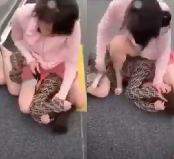 Xôn xao clip đánh ghen kinh hoàng: Vợ đè tiểu tam xuống đường, dùng guốc nhọn đánh liên tục vào người-1