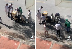 Đang chạy xe thì bị đổ cả thùng cua xuống đường, người đàn ông chứng kiến nhóm thanh niên xúm lại làm một việc không ai ngờ