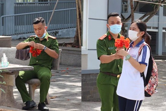 Hình ảnh dễ thương nhất hôm nay: Anh công an cặm cụi kết hoa phượng, tặng thí sinh đầu tiên bước ra khỏi phòng thi