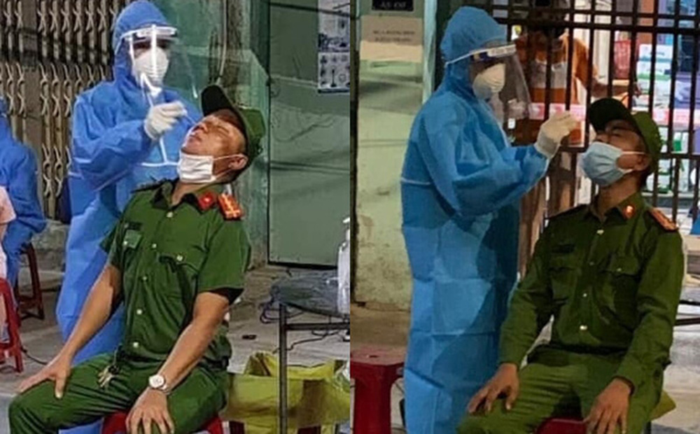 Vợ lấy mẫu xét nghiệm Covid-19 cho chồng đang trực chốt: Chỉ kịp động viên nhau qua ánh mắt-1