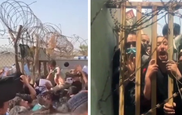 Những bà mẹ Afghanistan tuyệt vọng ném con qua rào chắn, xin người ta đưa chúng đi thật xa: Quặn lòng ánh mắt những đứa trẻ tìm mẹ-2