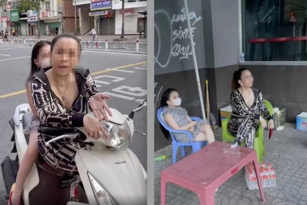Chị đại quận 4” lại tái xuất: Vẫn không đeo khẩu trang, dẫn con gái đi lang thang trên phố trong ngày đầu TP.HCM siết chặt giãn cách-1