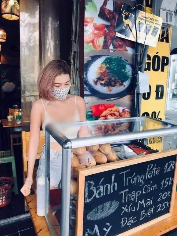 Cô chủ quán nóng bỏng đứng bán bánh mì làm dân mạng chao đảo-1