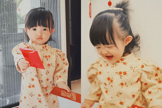 Con gái Đông Nhi xúng xính áo dài khoe lì xì Tết, biểu cảm hài hước khiến ai cũng phì cười