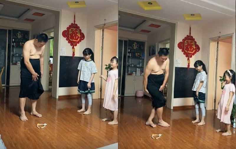 Clip: Ông bố thị phạm mặc váy, dạy 2 cô con gái cách cúi xuống nhặt đồ sao cho thanh lịch khiến dân mạng cười bò-1