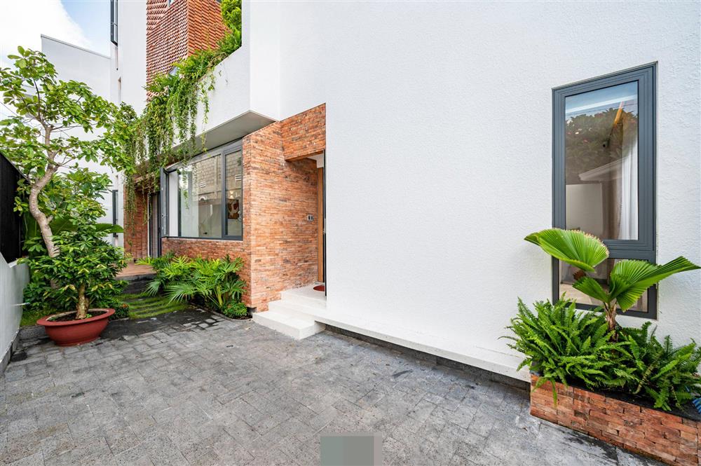 Tổ ấm của gia đình 3 thế hệ với không gian xanh và mảng tường gạch nung hoài cổ-9