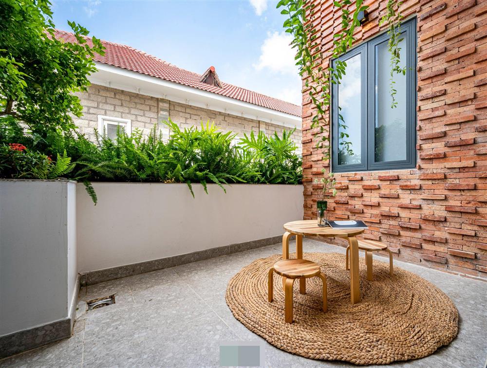 Tổ ấm của gia đình 3 thế hệ với không gian xanh và mảng tường gạch nung hoài cổ-15