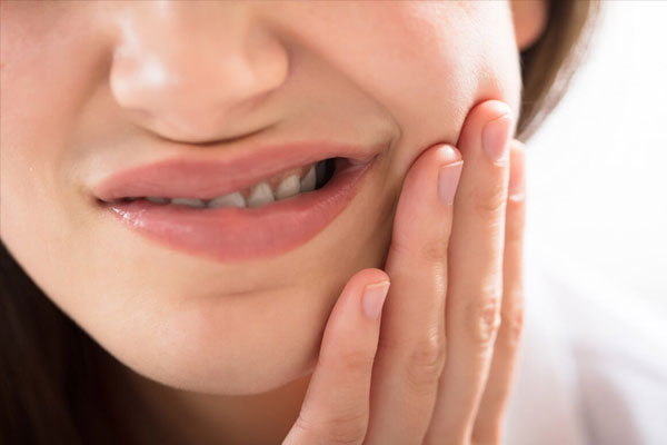 Triệu chứng sưng má cảnh báo căn bệnh nguy hiểm-1